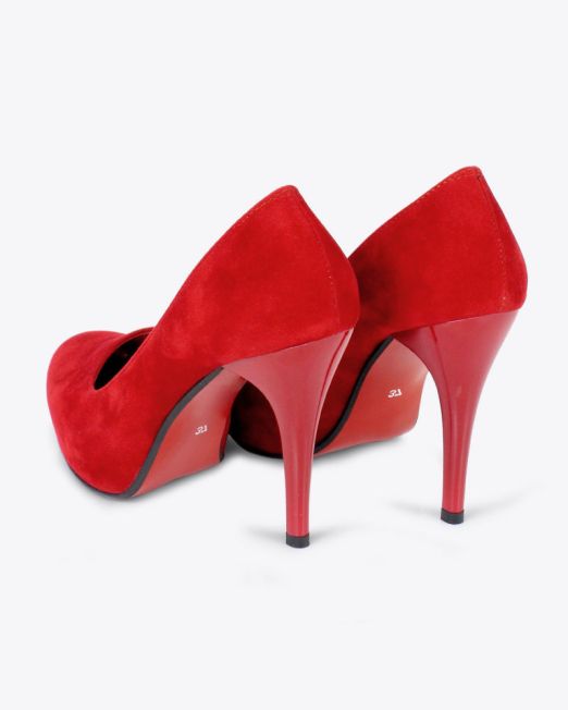 A pair of red high-heeled shoes with a suede finish, shown from the back and side on a white background.
