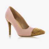 A pink high-heeled shoe with a pointed cork-textured toe and a matching cork-textured stiletto heel, displayed on a white background.