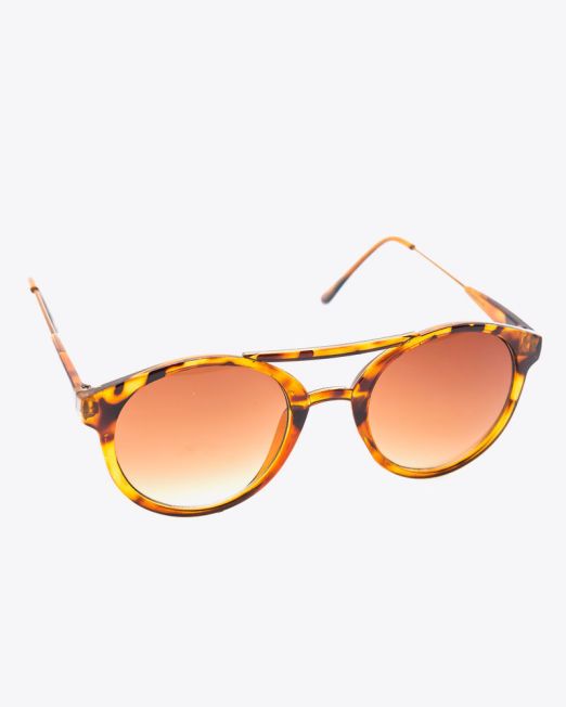 Tortoiseshell sunglasses with round, brown gradient lenses and a thin, patterned plastic frame, displayed at an angle on a plain white background.
