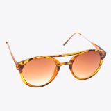 Tortoiseshell sunglasses with round, brown gradient lenses and a thin, patterned plastic frame, displayed at an angle on a plain white background.