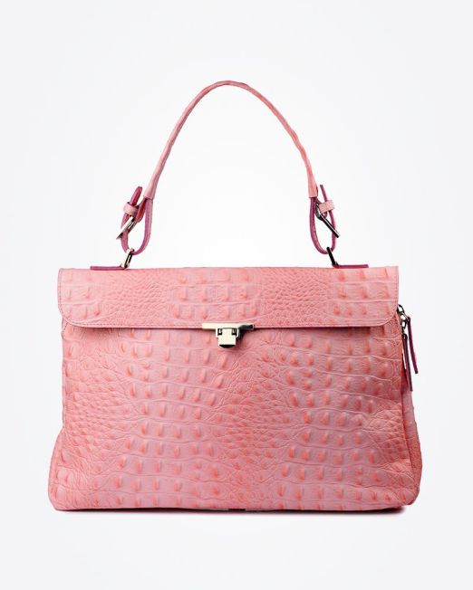 A pink crocodile-textured handbag with a top handle, flap closure, and silver-tone clasp, displayed against a plain white background.