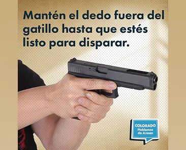 A hand holds a handgun with a finger positioned outside the trigger guard. The text in Spanish reads, Mantén el dedo fuera del gatillo hasta que estés listo para disparar, and the logo for Colorado Hablemos de Armas is in the corner.