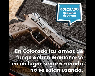 A semi-automatic handgun in a foam-lined case with text in Spanish stating that firearms in Colorado must be stored securely when not in use.
