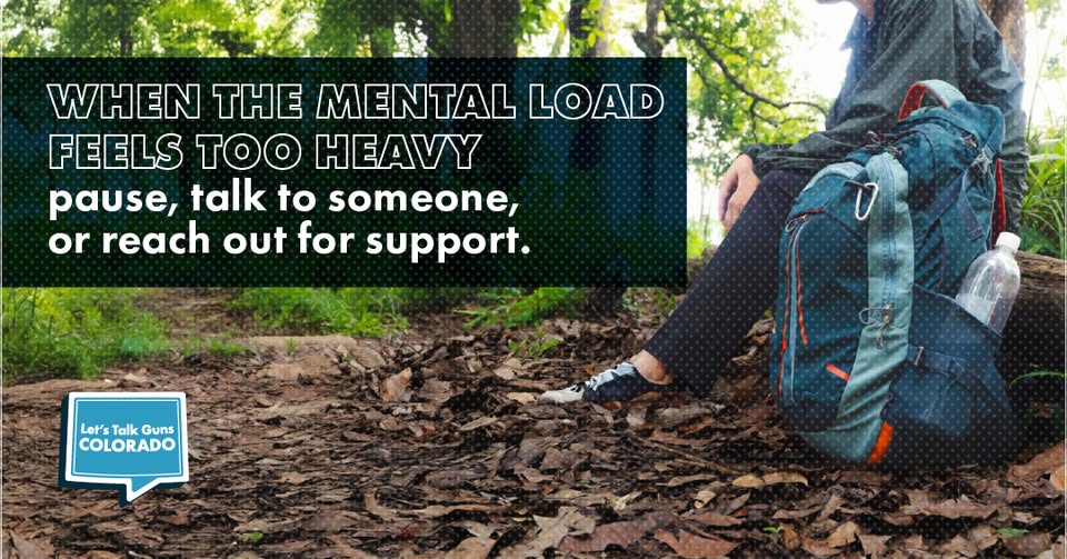 A person sits on a log in a forest next to a backpack. Text overlay reads: When the mental load feels too heavy, pause, talk to someone, or reach out for support. The Lets Talk Guns Colorado logo is in the corner.